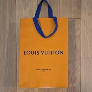 LOUIS VUITTON • Tall Orange Bag with Bold Blue Handles